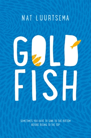 Book cover for Goldfish. The background is a lighter blue with darker blue fish covering it going in a swirling pattern. Inside of the O of Goldfish are 3 yellow fish looking at one other yellow fish  who has swum out of the D. 